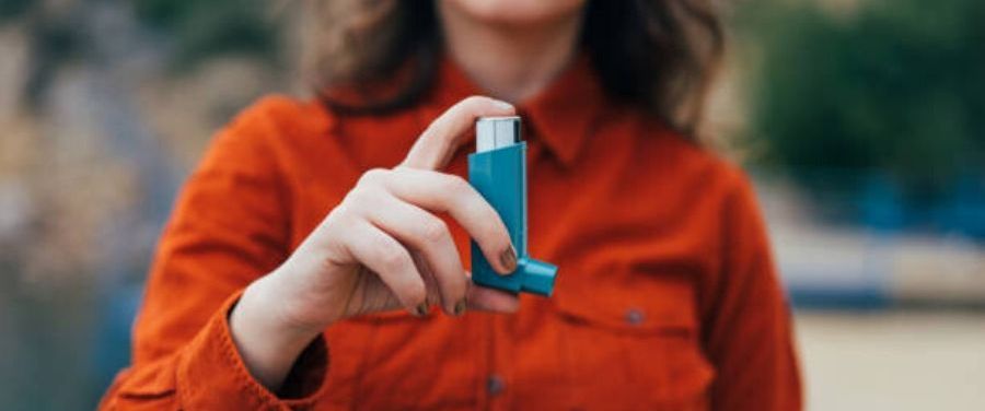Girl Holding Asthmatic Inhaler