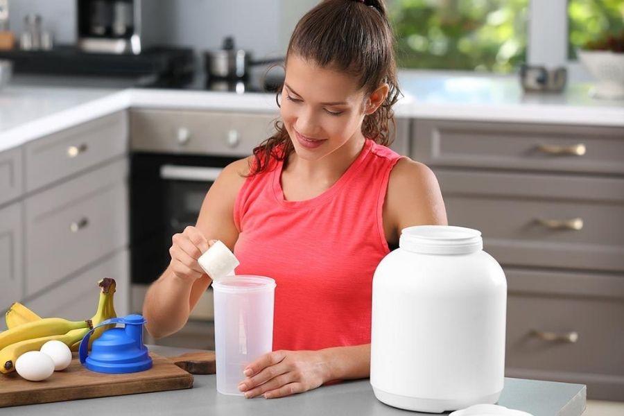 Pregnant Woman Taking Protein Supplement